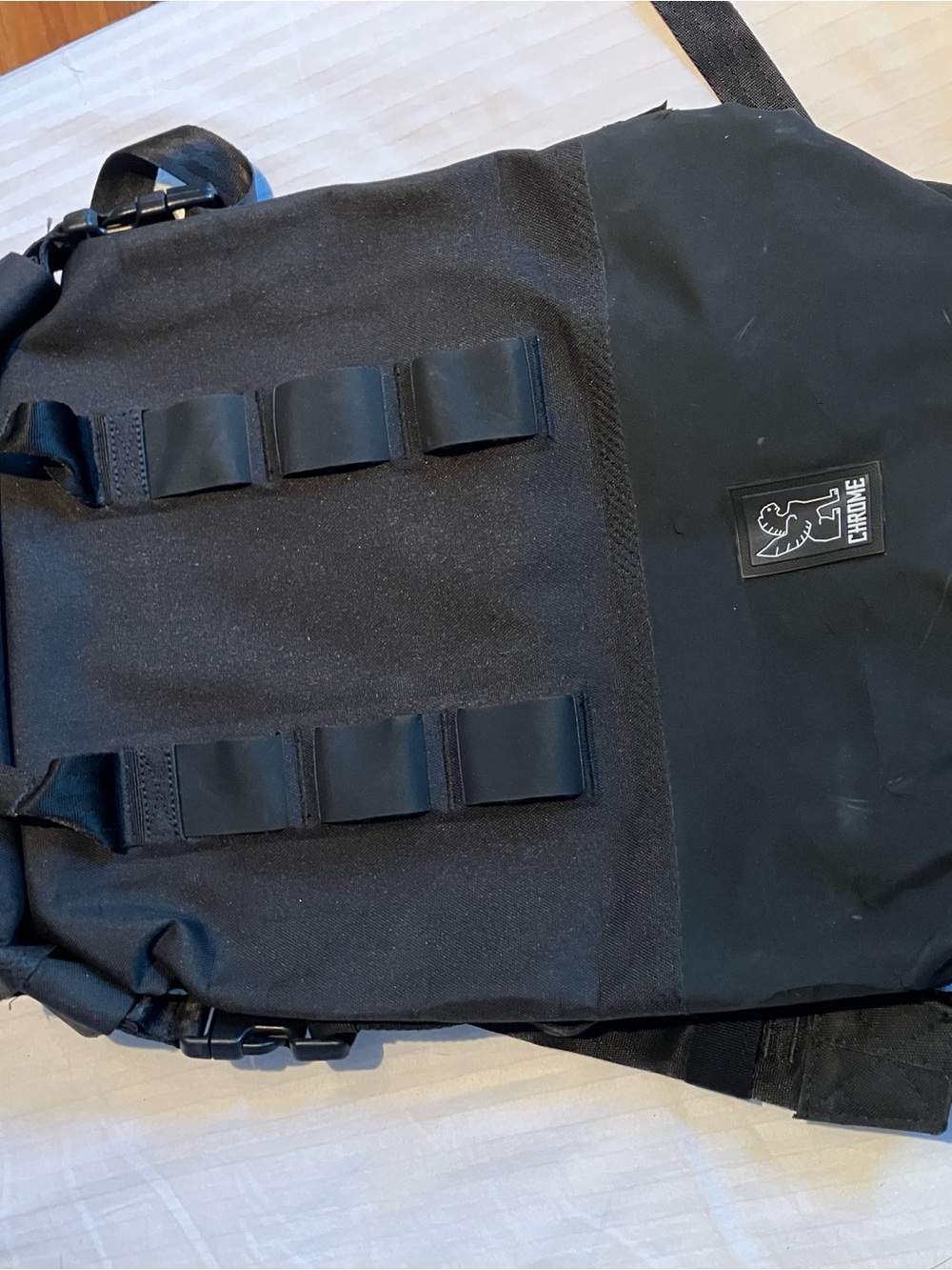 Chrome Industries black roll top waterproof backpack with attachment loops